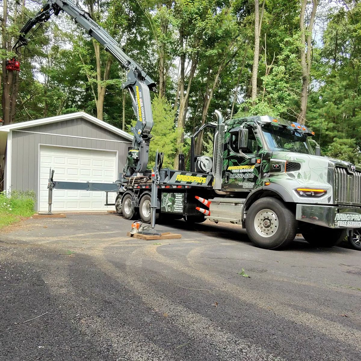 Crane truck on a tree removal job